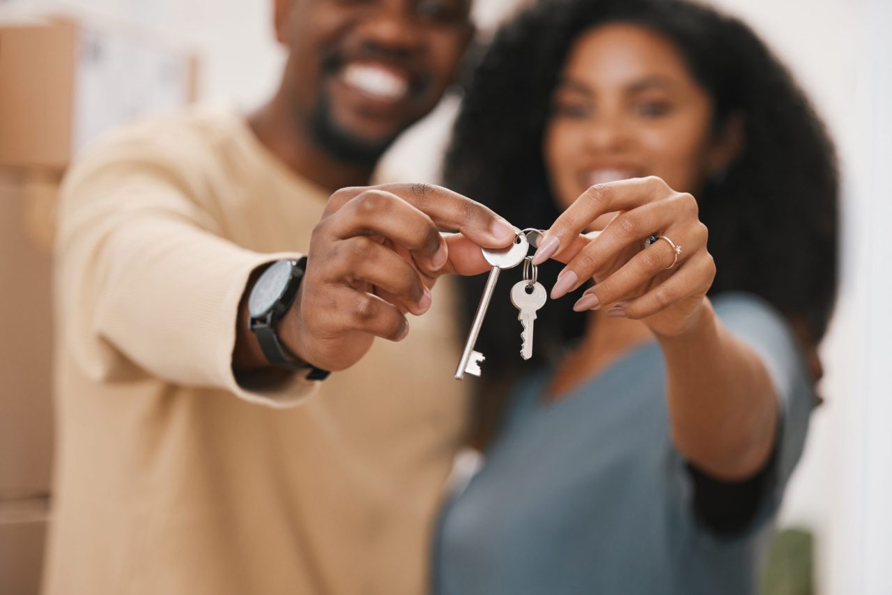 Happy couple, hands and keys in real estate, new home or property for investment, goals or mortgage